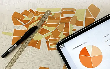 Wärmebedarfsdiagramm auf einer technischen Zeichnung mit Stift und Lineal.